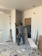 Installing drywall in studio