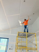 Tape being applied to ceiling