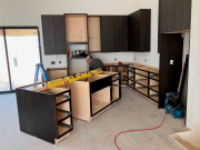 Kitchen cabinets being installed