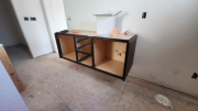 Bathroom floating cabinets installation in progress