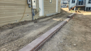 Retaining wall on east side for better drainage control