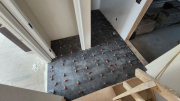 Hallway tiles installed with leveling clips