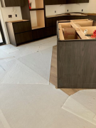 Kitchen floor covered with protective material