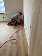 Jim installing baseboards