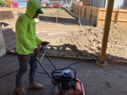 Wetting & compacting road base at rear lower patio