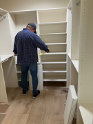 Wade installing shelves in custom closet