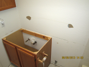 Mirror & countertop in upper bath are removed