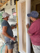 Paul & Carlos installing entry door
